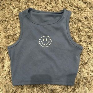 Blue tank with smiley face 
NEVER WORN!!🩵